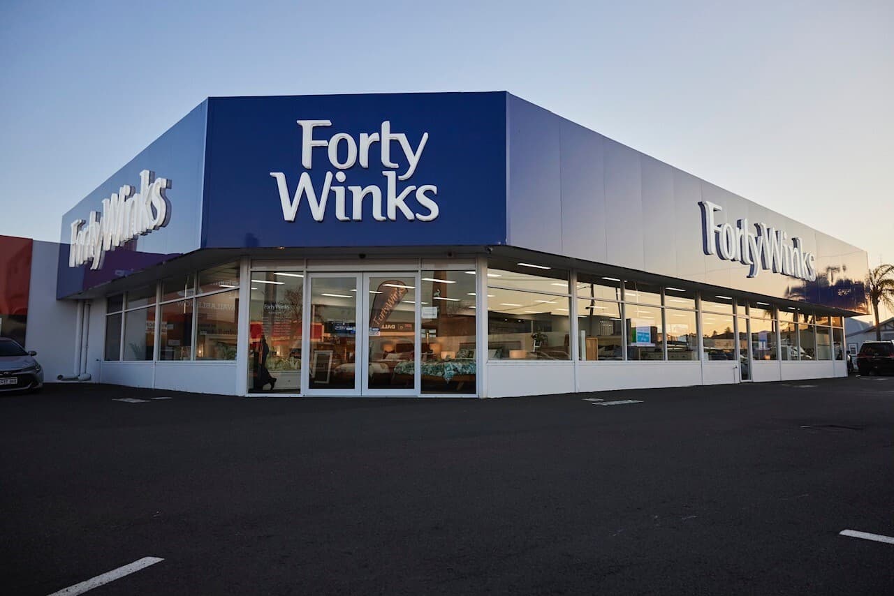 Forty Winks store exterior at dusk.