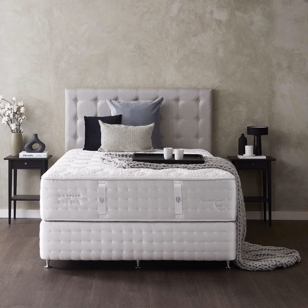 King Koil mattress and base in a calm, neutral bedroom.
