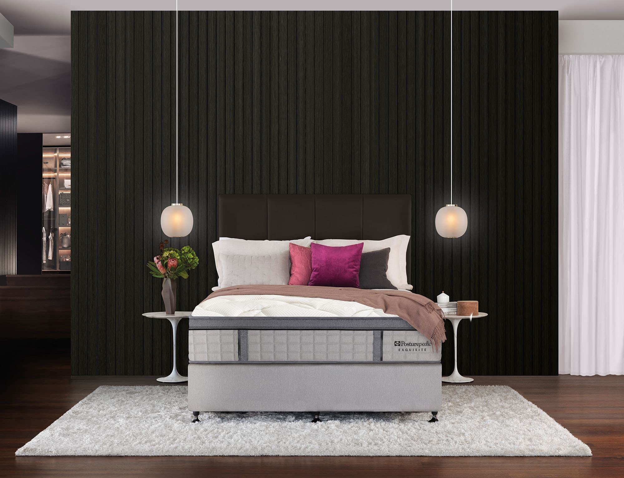 Pillow-top mattress on a bed in a dark, modern bedroom.