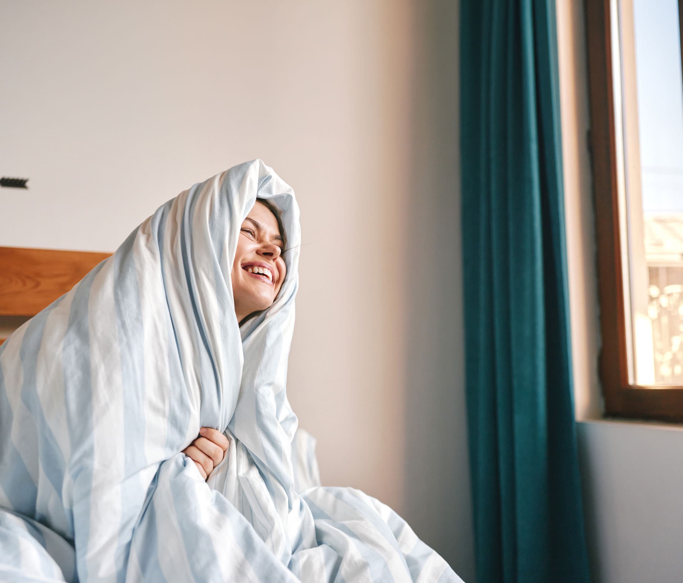 A person asleep in a softly lit bedroom