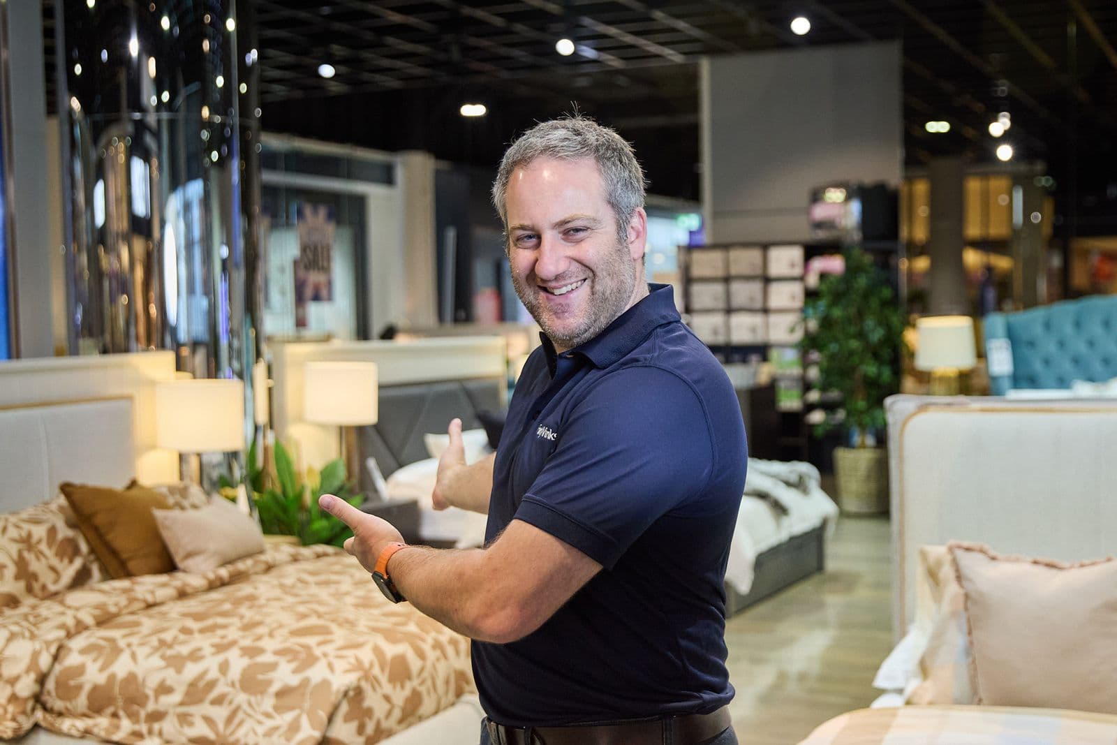 A trusted Forty Winks Sleep Advisor helping customers choose a mattress at the Darwin store